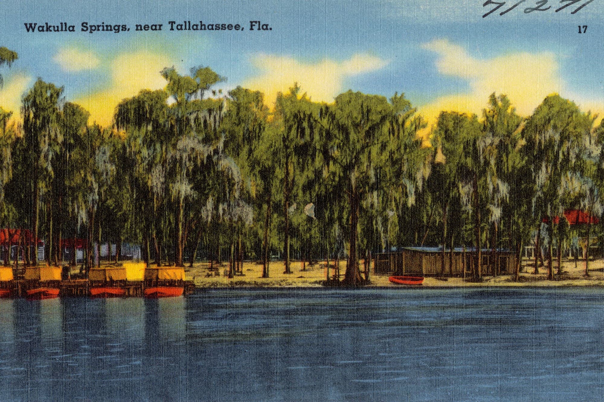 A tinted postcard of Wakulla Springs south of Tallahassee, with boats on the spring run under cypress trees.