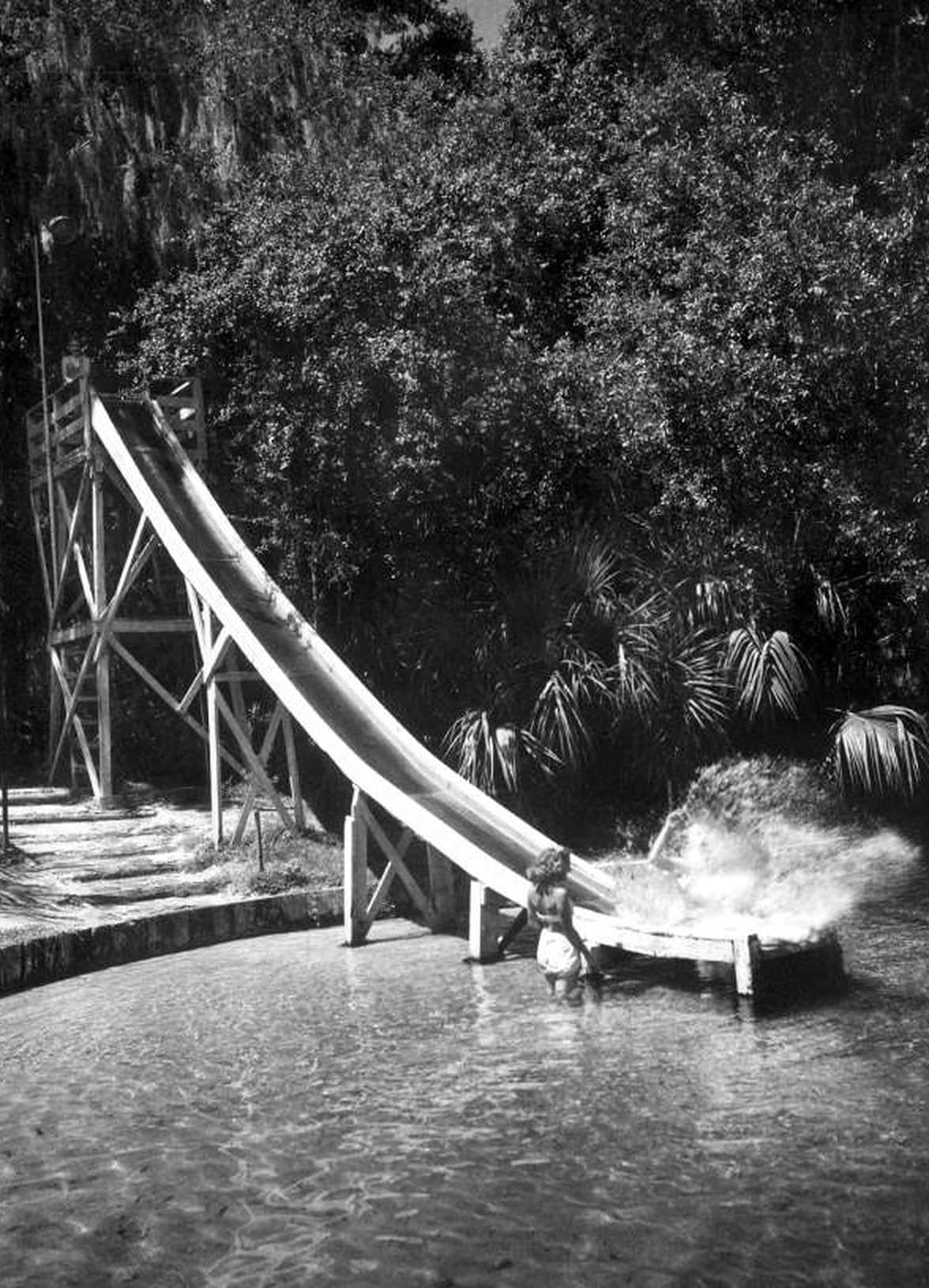 The slide, 1946. The river was diverted around a sand beach and the pool held at a constant depth